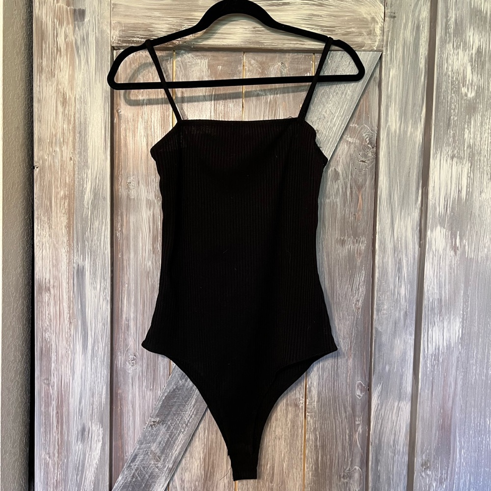Ribbed black bodysuit.